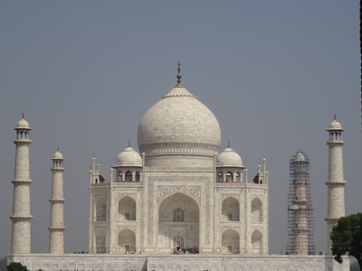 The Taj Mahal. The four towers are leaning a bit to the outside. It was build like this on purpose, in case an earthquake ever occured the towers would fall to the outside instead of towards the main building.